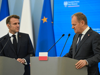 WARSAW, POLAND - DECEMBER 12:
Polish Prime Minister Donald Tusk (R) delivers remarks during a joint press conference with French President E...