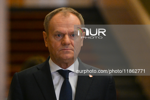 WARSAW, POLAND - DECEMBER 12:
Polish PM Donald Tusk heads to welcome French President Emmanuel Macron at the PM's Office in Warsaw, Poland,...