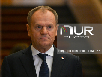 WARSAW, POLAND - DECEMBER 12:
Polish PM Donald Tusk heads to welcome French President Emmanuel Macron at the PM's Office in Warsaw, Poland,...