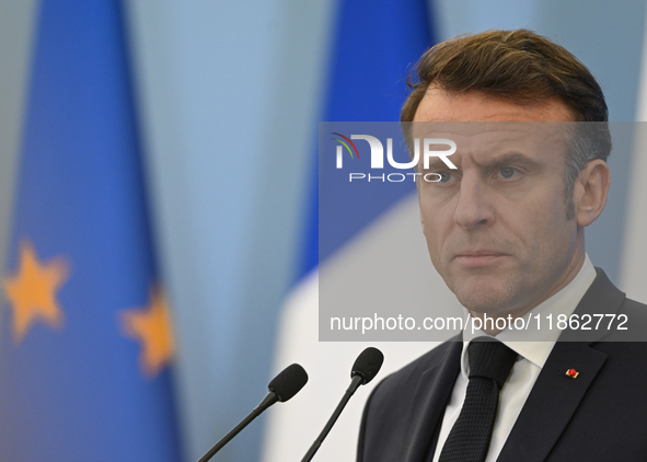 WARSAW, POLAND - DECEMBER 12:
French President Emmanuel Macron delivers remarks during a joint press conference with Polish Prime Minister D...