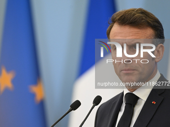 WARSAW, POLAND - DECEMBER 12:
French President Emmanuel Macron delivers remarks during a joint press conference with Polish Prime Minister D...