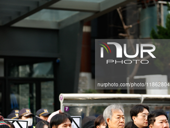 Around 30 members of the Korean Confederation of Trade Unions (KCTU) and other civil society groups hold a press conference in front of the...