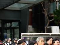 Around 30 members of the Korean Confederation of Trade Unions (KCTU) and other civil society groups hold a press conference in front of the...