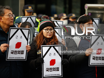 Around 30 members of the Korean Confederation of Trade Unions (KCTU) and other civil society groups hold a press conference in front of the...