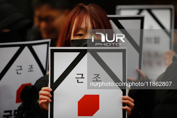 Around 30 members of the Korean Confederation of Trade Unions (KCTU) and other civil society groups hold a press conference in front of the...