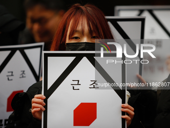 Around 30 members of the Korean Confederation of Trade Unions (KCTU) and other civil society groups hold a press conference in front of the...