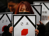 Around 30 members of the Korean Confederation of Trade Unions (KCTU) and other civil society groups hold a press conference in front of the...