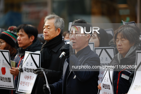 Around 30 members of the Korean Confederation of Trade Unions (KCTU) and other civil society groups hold a press conference in front of the...