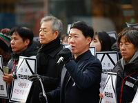 Around 30 members of the Korean Confederation of Trade Unions (KCTU) and other civil society groups hold a press conference in front of the...