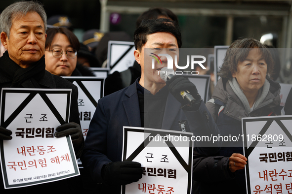 Around 30 members of the Korean Confederation of Trade Unions (KCTU) and other civil society groups hold a press conference in front of the...