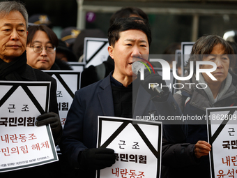 Around 30 members of the Korean Confederation of Trade Unions (KCTU) and other civil society groups hold a press conference in front of the...