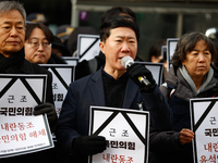 Around 30 members of the Korean Confederation of Trade Unions (KCTU) and other civil society groups hold a press conference in front of the...