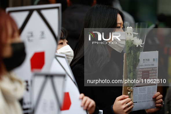 Around 30 members of the Korean Confederation of Trade Unions (KCTU) and other civil society groups hold a press conference in front of the...