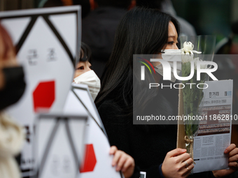 Around 30 members of the Korean Confederation of Trade Unions (KCTU) and other civil society groups hold a press conference in front of the...