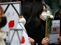 Around 30 members of the Korean Confederation of Trade Unions (KCTU) and other civil society groups hold a press conference in front of the...