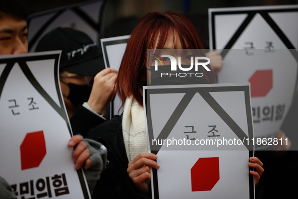 Around 30 members of the Korean Confederation of Trade Unions (KCTU) and other civil society groups hold a press conference in front of the...