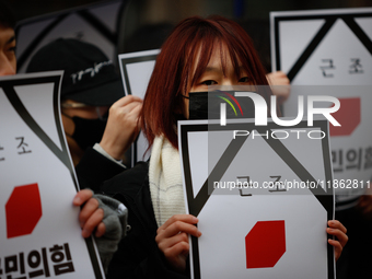 Around 30 members of the Korean Confederation of Trade Unions (KCTU) and other civil society groups hold a press conference in front of the...