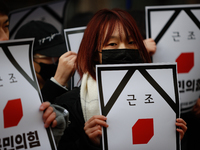 Around 30 members of the Korean Confederation of Trade Unions (KCTU) and other civil society groups hold a press conference in front of the...