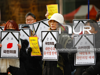 Around 30 members of the Korean Confederation of Trade Unions (KCTU) and other civil society groups hold a press conference in front of the...