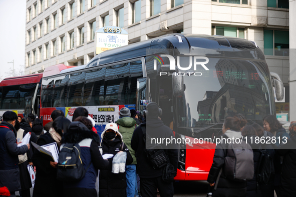 Around 30 members of the Korean Confederation of Trade Unions (KCTU) and other civil society groups finish a press conference in front of th...