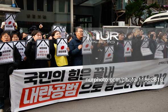 Around 30 members of the Korean Confederation of Trade Unions (KCTU) and other civil society groups hold a press conference in front of the...