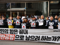 Around 30 members of the Korean Confederation of Trade Unions (KCTU) and other civil society groups hold a press conference in front of the...