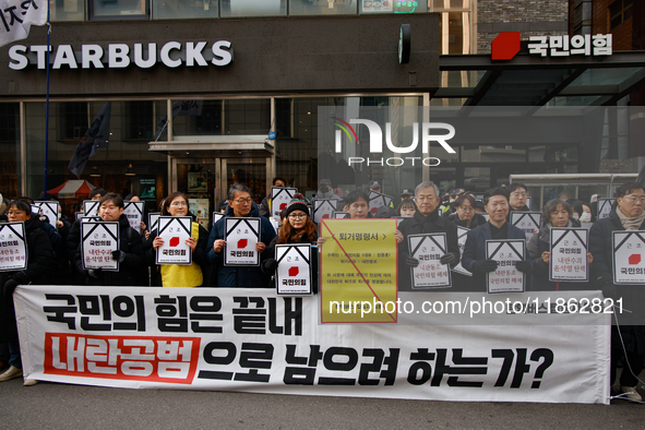 Around 30 members of the Korean Confederation of Trade Unions (KCTU) and other civil society groups hold a press conference in front of the...