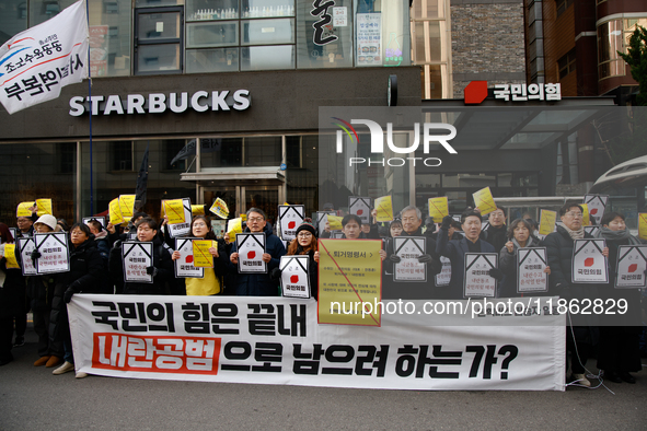 Around 30 members of the Korean Confederation of Trade Unions (KCTU) and other civil society groups hold a press conference in front of the...