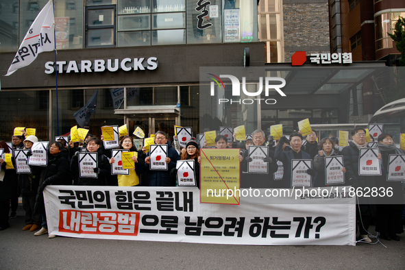 Around 30 members of the Korean Confederation of Trade Unions (KCTU) and other civil society groups hold a press conference in front of the...