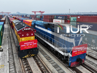 Two rail-sea freight trains leave Nanchang International Dry Port under the supervision of Ganjiang New District customs in Nanchang, East C...