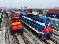 Two rail-sea freight trains leave Nanchang International Dry Port under the supervision of Ganjiang New District customs in Nanchang, East C...