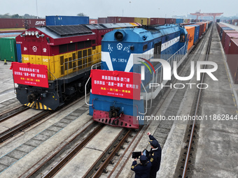 Two rail-sea freight trains leave Nanchang International Dry Port under the supervision of Ganjiang New District customs in Nanchang, East C...