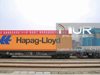 Two rail-sea freight trains leave Nanchang International Land Port Freight Yard in Nanchang, Jiangxi province, China, on December 12, 2024....