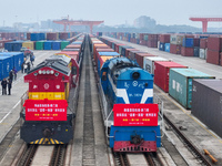 Two rail-sea freight trains leave Nanchang International Land Port Freight Yard in Nanchang, Jiangxi province, China, on December 12, 2024....