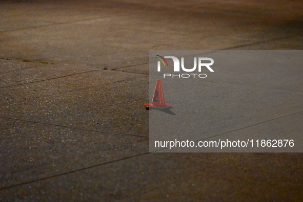 The NYPD evidence collection team gathers evidence and marks shell casings at the scene where two people are shot at Lafayette Gardens NYCHA...