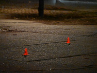 The NYPD evidence collection team gathers evidence and marks shell casings at the scene where two people are shot at Lafayette Gardens NYCHA...