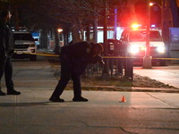 The NYPD evidence collection team gathers evidence and marks shell casings at the scene where two people are shot at Lafayette Gardens NYCHA...