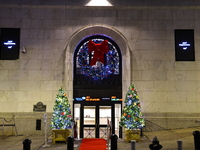 Christmas decorations are on Broad Street outside the New York Stock Exchange in New York, N.Y., on December 12, 2024. The photo is taken as...