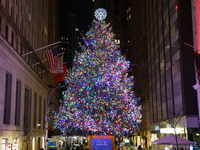 The Christmas tree on Broad Street and colored seasonal lights illuminate the New York Stock Exchange in New York, N.Y., on December 12, 202...