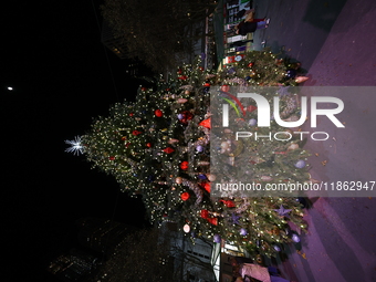 A Christmas tree stands in the Winter Village in Bryant Park in the heart of New York, N.Y., on December 12, 2024. The photo is taken as a l...