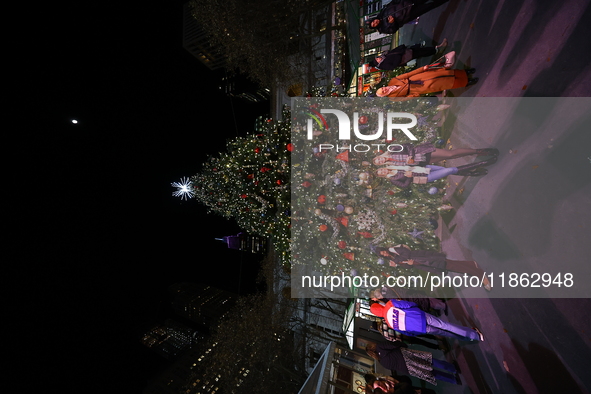 A Christmas tree stands in the Winter Village in Bryant Park in the heart of New York, N.Y., on December 12, 2024. The photo is taken as a l...