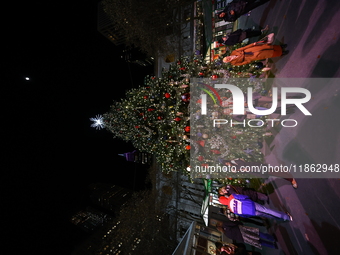 A Christmas tree stands in the Winter Village in Bryant Park in the heart of New York, N.Y., on December 12, 2024. The photo is taken as a l...