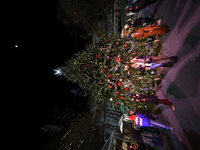 A Christmas tree stands in the Winter Village in Bryant Park in the heart of New York, N.Y., on December 12, 2024. The photo is taken as a l...