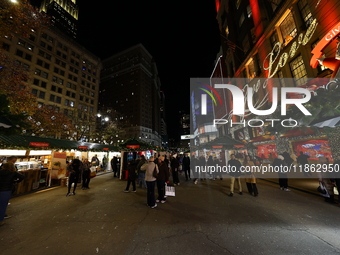 The Christmas decorations are outside Macy's Department Store in New York, N.Y., on December 12, 2024. The photo is taken as a long exposure...