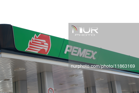 The logo of the state-owned oil company Petroleos Mexicanos (PEMEX) appears on the facade of a gas station in Mexico City, Mexico, on Decemb...