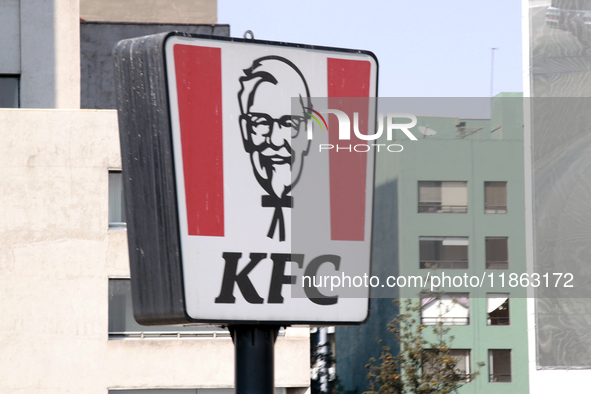 The logo of the Kentucky Fried Chicken (KFC) fast food restaurant company is seen in Mexico City, Mexico, on December 12, 2024. (Photo Illus...