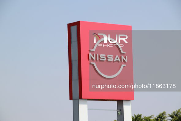 The logo of the Japanese automobile company Nissan is seen in Mexico City, Mexico, on December 12, 2024. (Photo Illustration by Jose Luis To...