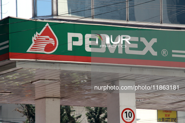 The logo of the state-owned oil company Petroleos Mexicanos (PEMEX) appears on the facade of a gas station in Mexico City, Mexico, on Decemb...