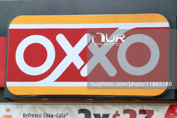 The logo of the Mexican convenience store company OXXO is seen on a facade in Mexico City, Mexico, on December 12, 2024. (Photo Illustration...