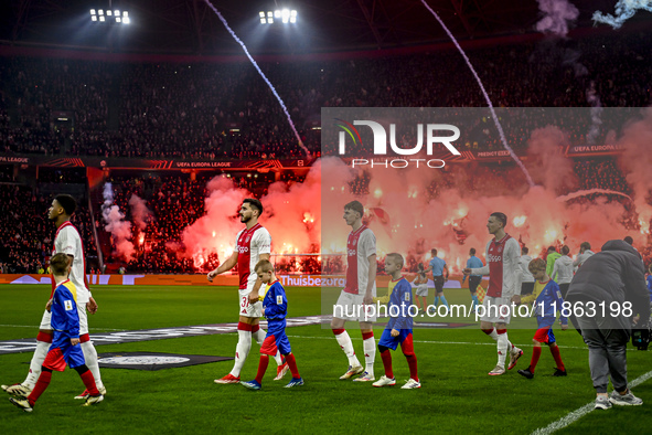 AFC Ajax Amsterdam defender Josip Sutalo, AFC Ajax Amsterdam defender Youri Baas, and AFC Ajax Amsterdam forward Steven Berghuis participate...